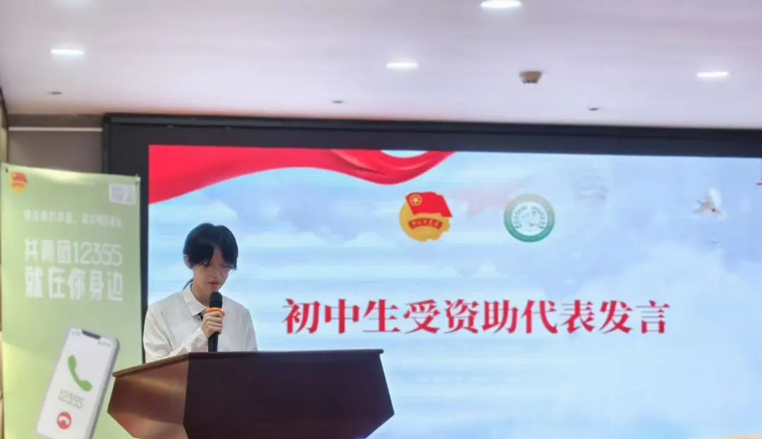 A junior high school student representative for the grant recipients, stands at a podium and delivers a speech to the audience. A junior high school student representative for the grant recipients, stands at a podium and delivers a speech to the audience.